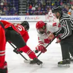 Ohio State forward Sloane Matthews and Wisconsin forward Marianne Picard face-off during the 2026 WCHA women's hockey tournament championship game.