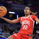 Jaloni Cambridge #22 of the Ohio State Buckeyes takes a shot against the UCLA Bruins during the second half of the Big Ten Women's Basketball Tournament semifinals game at Gainbridge Fieldhouse on March 07, 2026 in Indianapolis, Indiana.