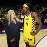 Flau'jae Johnson #4 of the LSU Tigers is interviewed by ESPN reporter Holly Rowe after a game against the Tennessee Lady Volunteers at Pete Maravich Assembly Center on February 26, 2026 in Baton Rouge, Louisiana ahead of the Women's March Madness NCAA basketball tournament Elite 8.