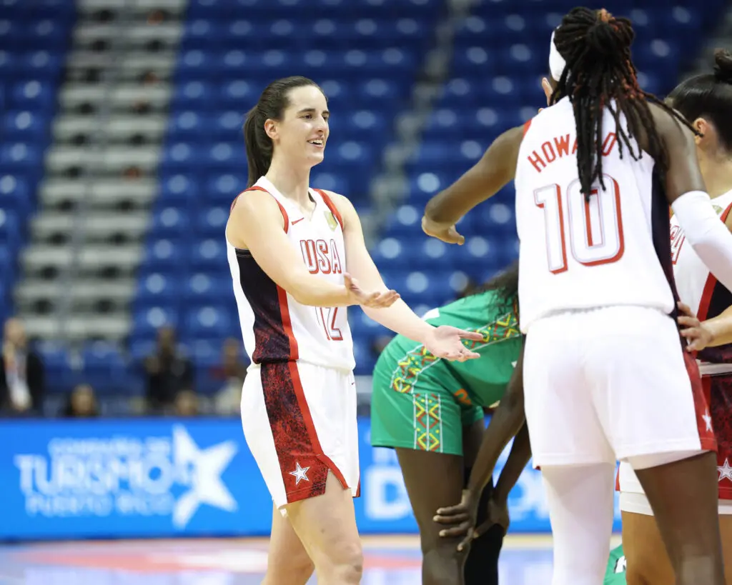 USA Basketball guard Caitlin Clark high-fives teammate Rhyne Howard during a 2026 FIBA World Cup Qualifying Tournament game vs. Senegal.
