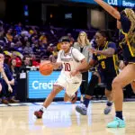 UMass Minutemen guard Yahmani McKayle (10) drives to the basket as Toledo Rockets guard Patricia Anumgba (8) and Toledo Rockets forward Miriam Diala (21) defend during the second quarter of the MAC Women's Basketball Tournament Quarterfinal game between the UMass Minutemen and Toledo Rockets on March 11, 2026, at Rocket Arena in Cleveland, OH.