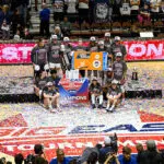 UConn Huskies players pose for a team photo following the BIG EAST Tournament Championship game between the UConn Huskies and the Villanova Wildcats on March 9, 2026 at Mohegan Sun Arena in Uncasville, CT. The Huskies defeated the Wildcats 90-51.