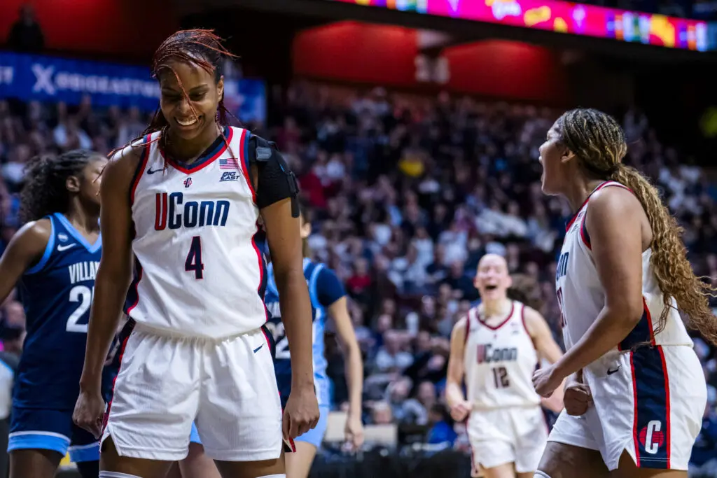 UConn freshman Blanca Quiñonez and sophomore Sarah Strong celebrate a play during the 2026 Big East women's basketball tournament championship game.