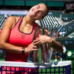 Aryna Sabalenka smiles while posing with her championship trophy after the 2026 BNP Paribas Open at Indian Wells final.