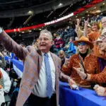 Head coach Vic Schaefer of the Texas Longhorns takes a photo with fans after defeating the South Carolina Gamecocks during the championship game of the SEC Women's Basketball Tournament at Bon Secours Wellness Arena on March 08, 2026 in Greenville, South Carolina.