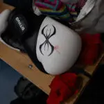 A blood-stained boxing glove is pictured during a training session in Nuuk, Greenland, on March 4, 2026. Greenland has one of the highest suicide rates in the world, especially among teenagers and young adults. Psychiatric care is uneven, and many youths must leave their families to study in Nuuk. In the capital, many turn to boxing as a way to channel their pain. (Photo by Florent VERGNES / AFP via Getty Images)