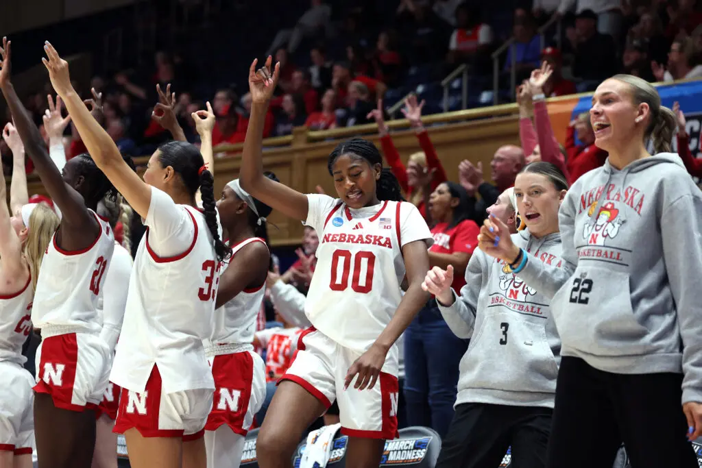 The Nebraska women's basketball bench celebrates a play during their 2026 First Four game.