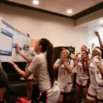 Before its Women's March Madness game with Georgia basketball members of the Virginia Cavaliers women's basketball team celebrate after beating the Arizona State Sun Devils during a First Four game of the 2026 NCAA Women's Basketball Tournament held at Carver-Hawkeye Arena on March 19, 2026 in Iowa City, Iowa.