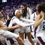 Guard Olivia Miles is mobbed by her TCU teammates during a TV interview as they celebrate their second-round win in the 2025/26 NCAA women's basketball tournament.