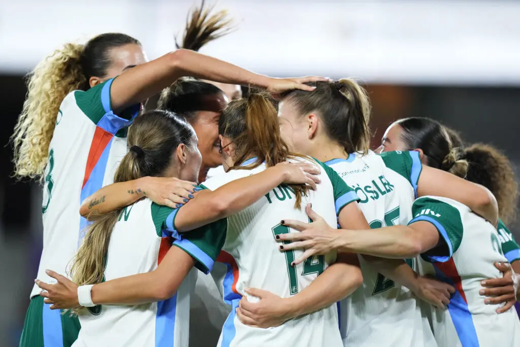 Denver Summit teammates celebrate a goal by Melissa Kossler during a 2026 NWSL match.