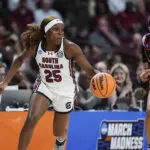 South Carolina guard Raven Johnson dribbles the ball as USC guard Jazzy Davidson gives chase during their second-round game in the 2025/26 NCAA women's basketball tournament.