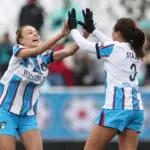 Chicago Stars midfielder Julia Grosso and center back Sam Staab high-five after a goal from teammate Tessa Dellarose during a 2026 NWSL match.