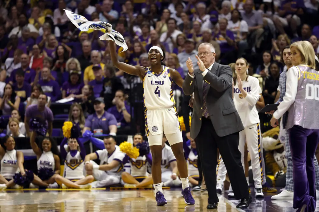 Flau'jae Johnson #4 of the LSU Tigers reacts from the bench during the first half of a game against the Texas Tech Lady Raiders in the second round of the 2026 NCAA Women's Basketball Tournament at Pete Maravich Assembly Center on March 22, 2026 in Baton Rouge, Louisiana.