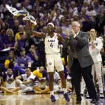 Flau'jae Johnson #4 of the LSU Tigers reacts from the bench during the first half of a game against the Texas Tech Lady Raiders in the second round of the 2026 NCAA Women's Basketball Tournament at Pete Maravich Assembly Center on March 22, 2026 in Baton Rouge, Louisiana.