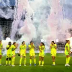 The visiting Washington Spirit react to fireworks before opponent Racing Louisville's 2026 NWSL home opener.