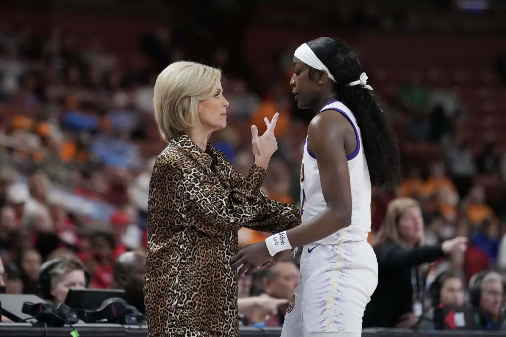March Madness LSU Lady Tigers head coach Kim Mulkey talks with guard Flau'jae Johnson (4) in the first quarter against the Georgia Lady Bulldogs at Bon Secours Wellness Arena. 