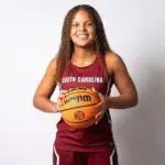 High School recruit Jerzy Robinson poses for a portrait wearing a South Carolina jersey and holding a basketball.