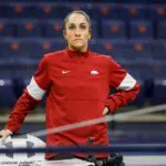Arkansas gymnastics coach and Olympic gold medalist Jordyn Wieber watches warm ups prior to a meet against Auburrn at Neville Arena on January 20, 2023 in Auburn, Alabama.