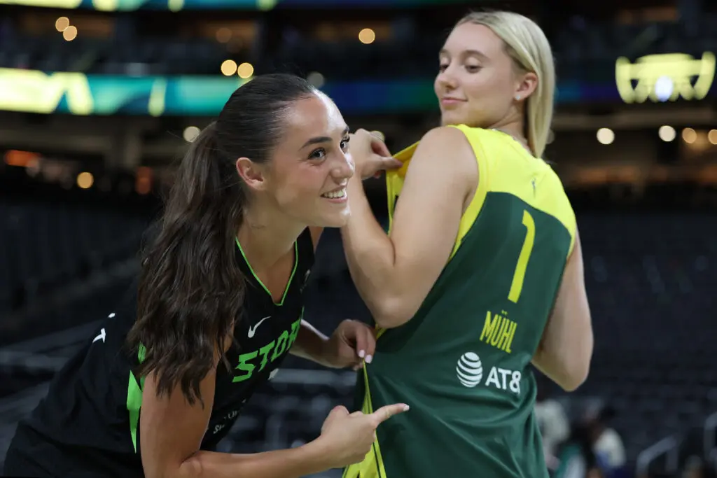Nika Muhl #1 of the Seattle Storm poses for a portrait with former college teammate Paige Bueckers #5 of the Connecticut Huskies after the game between the Seattle Storm and the Chicago Sky at Climate Pledge Arena on July 05, 2024 in Seattle, Washington.
