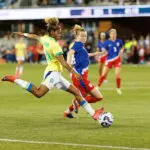 Luany #19 of Brazil strikes the ball while defended by Emily Sonnett #14 of the United States during an international friendly game between Brazil and USWNT at PayPal Park on April 8, 2025 in San Jose, California.