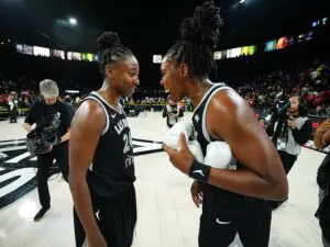 Jewell Loyd #24 and Chelsea Gray #12 of the Las Vegas Aces smiles after the game against the Seattle Storm on September 18, 2025 at Michelob ULTRA Arena n Las Vegas, Nevada.