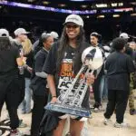 Jackie Young #0 of the Las Vegas Aces poses for a photo with the 2025 WNBA Championship trophy after the game against the Phoenix Mercury on October 10, 2025 at PHX Arena in Phoenix, Arizona.