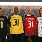 Mexico federation president Mikel Arriola, Jamaica federation president Michael Ricketts, Costa Rica federation president Osael Maroto, and U.S. Soccer President Cindy Parlow Cone hold up jerseys as they announce the four countries hosting the 2031 FIFA Women's World Cup during the FIFA Women's World Cup 2031 Bid Announcement Event on October 20, 2025 in New York City.
