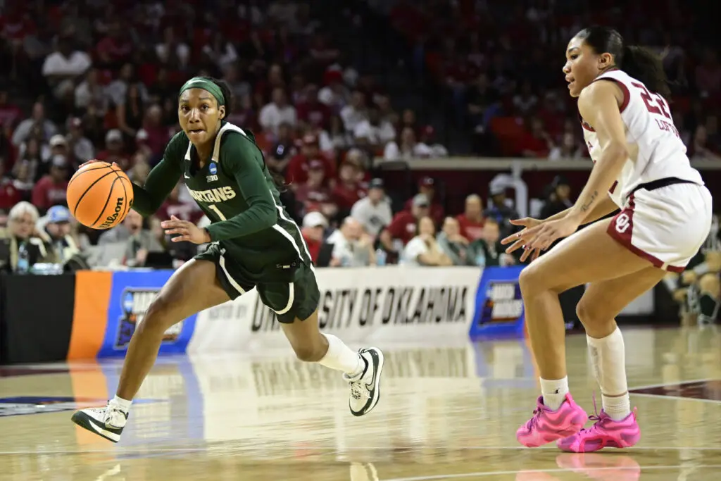 NCAA transfer portal candidate Rashunda Jones #1 of the Michigan State Spartans attempts to drive past Keziah Lofton #22 of the Oklahoma Sooners during the first quarter during a second round game of the 2026 NCAA Women's Basketball Tournament held at Lloyd Noble Center on March 22, 2026 in Norman, Oklahoma.