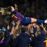 Alexia Putellas of FC Barcelona is thrown in the air in celebration by team mates and staff following the team's 6-0 victory in her 500th club appearance in the UEFA Women's Champions League 2025/26 Quarter-finals Second Leg match between FC Barcelona and Real Madrid CF at Nou Camp on April 02, 2026 in Barcelona, Spain.