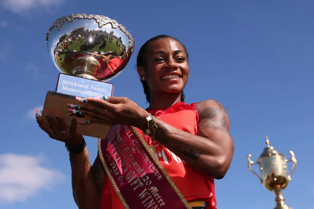 Sha'Carri Richardson poses with a trophy after winning the Powercor Women's Gift during the 2026 Stawell Gift at Central Park on April 06, 2026 in Stawell, Australia.