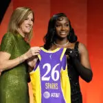 Ta’Niya Latson (R) of South Carolina poses with WNBA Commissioner Cathy Engelbert (L) after being selected with the 20th pick in the second round by the Los Angeles Sparks during the 2026 WNBA Draft at The Shed on April 13, 2026 in New York City.
