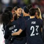 USWNT player Naomi Girma #4 of United States celebrates with teammates after scoring the team's first goal during the international friendly match between United States and Japan at Dick's Sporting Goods Park on April 17, 2026 in Commerce City, Colorado.