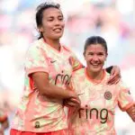 Pietra Tordin #19 of Portland Thorns FC celebrates scoring team's first goal with teammate Sam Hiatt #16 during the NWSL match between Angel City FC and Portland Thorns FC at BMO Stadium on April 26, 2026 in Los Angeles, California.