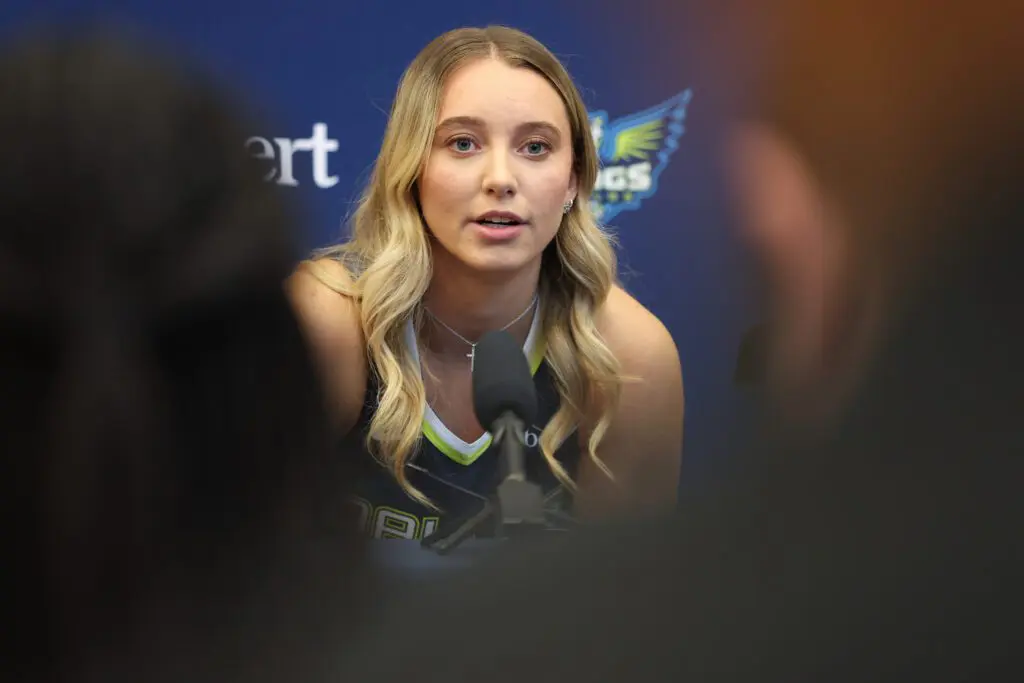 Paige Bueckers #5 of the Dallas Wings responds to media questions and her relationship with Azzi Fudd during 2026 Dallas Wings Media Day at College Park Center on April 27, 2026 in Arlington, Texas.
