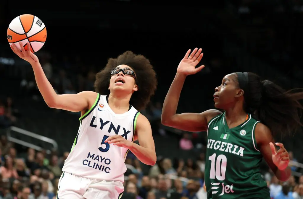 Olivia Miles #5 of the Minnesota Lynx drives with the ball as Promise Amukamara #10 of Nigeria defends during the preseason game at T-Mobile Center on April 27, 2026 in Kansas City, Missouri.