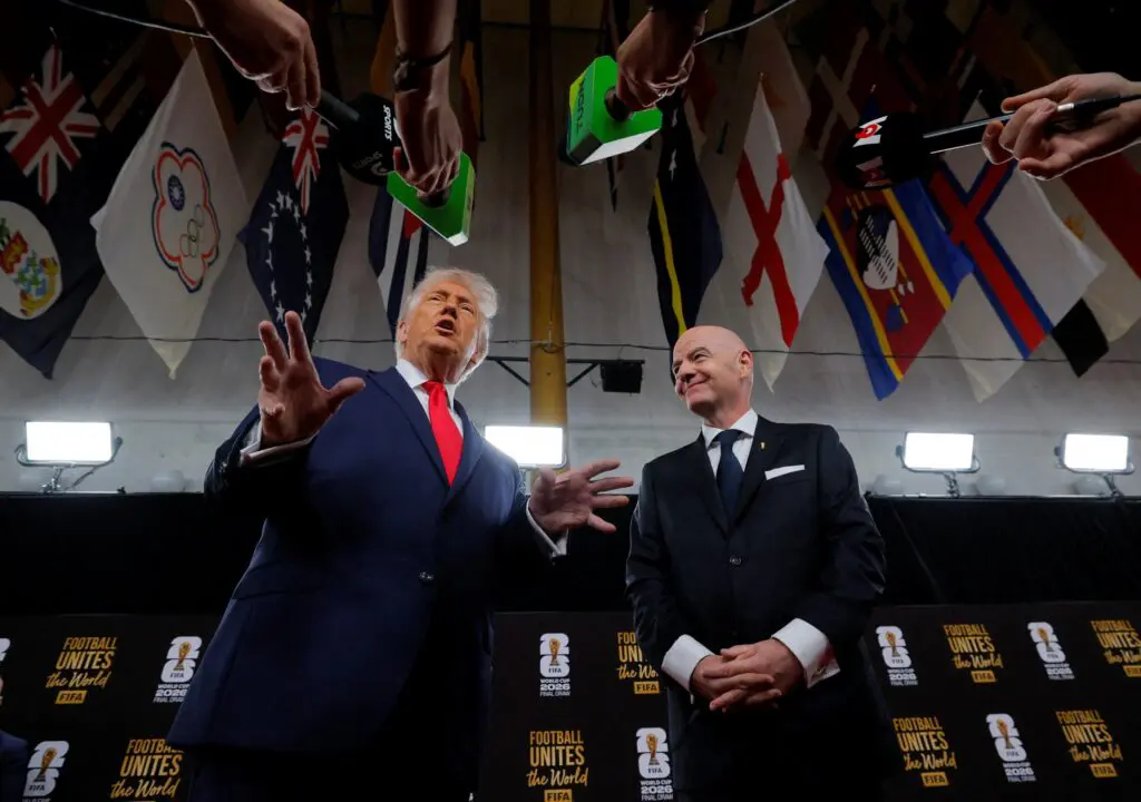 FIFA President Gianni Infantino and United States of America President Donald Trump speak to media as they arrive on the red carpet ahead of the FIFA World Cup 2026 Final Draw at John F. Kennedy Center for the Performing Arts.