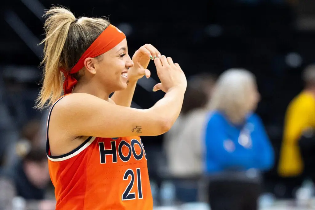 Virginia guard and transfer portal withdraws Kymora Johnson shows a heart to Cavalier supporters after defeating the Iowa Hawkeyes March 23, 2026 during a Round of 32 NCAA March Madness game at Carver-Hawkeye Arena in Iowa City, Iowa.