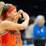 Virginia guard and transfer portal withdraws Kymora Johnson shows a heart to Cavalier supporters after defeating the Iowa Hawkeyes March 23, 2026 during a Round of 32 NCAA March Madness game at Carver-Hawkeye Arena in Iowa City, Iowa.