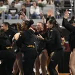 The Minnesota team celebrates during semifinals for the 2026 NCAA Gymnastics National Championships at Dickies Arena ahead of the gymnastics final four.