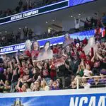 The University of Oklahoma fans celebrates after the Sooners finish in first place in the 2026 NCAA Women’s Gymnastics National Championships at Dickies Arena.