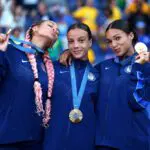 USWNT Triple Espresso Gold Medalists Trinity Rodman #5, Mallory Swanson #9, Sophia Smith #11 of the USWNT roster pose for a photo with the medals after the Women's Football medal ceremony following the Women's Gold Medal match between Brazil and United States of America during the Olympic Games Paris 2024 at Parc des Princes on August 10, 2024 in Paris, France.