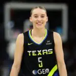 WNBA GM survey frontrunner Paige Bueckers #5 of the Dallas Wings smiles in the first quarter against the Minnesota Lynx at Target Center on September 01, 2025 in Minneapolis, Minnesota.