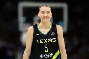 WNBA GM survey frontrunner Paige Bueckers #5 of the Dallas Wings smiles in the first quarter against the Minnesota Lynx at Target Center on September 01, 2025 in Minneapolis, Minnesota.