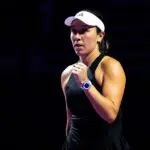 French Open 2026 upset victim Jessica Pegula celebrates a point in front of a black background ahead of her Roland Garros exit.