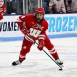 PWHL draft prospect Caroline Harvey #4 of the Wisconsin Badgers skates with the puck in the second period during the NCAA Women's Ice Hockey Championship game against the Ohio State Buckeyes held at Pegula Ice Arena on March 22, 2026 in State College, Pennsylvania.