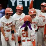 Texas Longhorns outfielder Kayden Henry (21) gets congratulated after hitting a three run home run during the SEC college softball game between Texas Longhorns and Oklahoma Sooners on April 12, 2026, at Red & Charline McCombs Field in Austin, Texas.