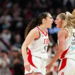 Guards Carla Leite #0 and Sarah Ashlee Barker #3 of the Portland Fire react after a successful three point basket was made during the first half of the game against the New York Liberty at Moda Center on May 12, 2026 in Portland, Oregon.