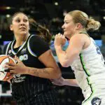 Kamilla Cardoso #10 of the Chicago Sky drives past Emese Hof #25 of the Minnesota Lynx during the first half at Wintrust Arena on May 23, 2026 in Chicago.