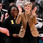 Iowa Hawkeyes head coach Jan Jensen claps her hands against the Michigan Wolverines during the second half at Gainbridge Fieldhouse ahead of series with Uconn women's basketball.