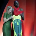 WNBA rookie temporary suspension subject Awa Fam poses with WNBA Commissioner Cathy Engelbert after being selected third overall by the Seattle Storm during the 2026 WNBA Draft at The Shed at Hudson Yards.